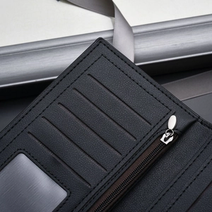 Slim black leather wallet showing internal card slots and a premium metal zipper