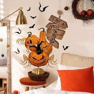 Close-up of Halloween wall stickers featuring stacked pumpkins, bats, and spell text