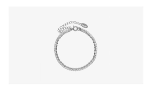 Detail of silver double-layer bracelet with sparkling zircons and K18 engraving
