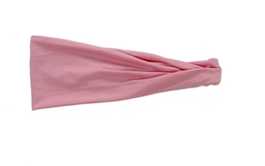 Detailed view of pink knotted sports headband with soft elastic moisture-wicking fabric