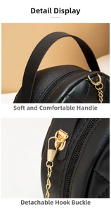 Detail of soft black quilted leather handle and detachable gold metal chain hook