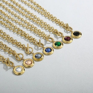 Set of 7 gold OT-clasp necklaces with round colorful crystal pendants on O-chain