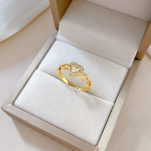 Gold heart-shaped chain ring with sparkling crystals in a premium jewelry box