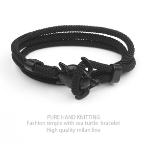 Hand-woven black sea turtle bracelet made of high-quality milan line on white background