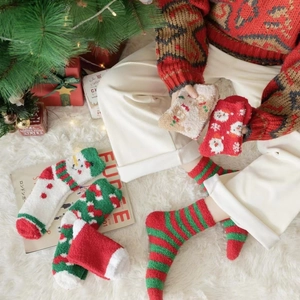 Thick coral fleece Christmas socks featuring festive Santa and snowman patterns for winter