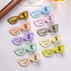 Set of ten colorful sunglasses-shaped hair clips in vibrant macaron shades