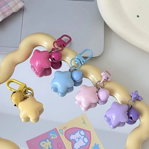 Colorful macaron star keychains with bells and metal clips in five vibrant pastel shades