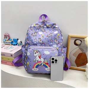 Detail of purple unicorn backpack showing rainbow prints and side mesh pocket