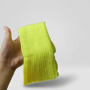 Close-up of fluorescent green ribbed knit leg warmer with detailed texture and neon hue