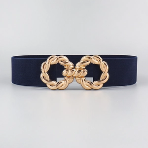 Detailed view of dark blue elastic waist belt featuring a gold twisted metal buckle