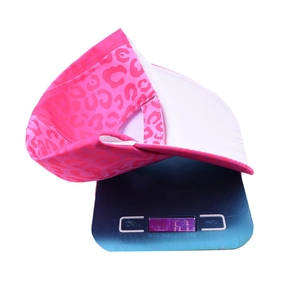 Pink leopard print baseball cap shown on a digital scale weighing 63g with white lining