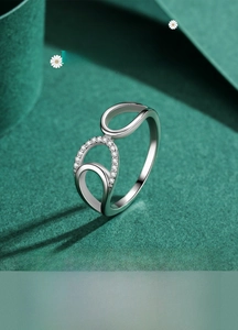 Macro detail of S925 sterling silver geometric ring with micro-pave zircon settings