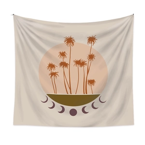 Detailed view of bohemian wall tapestry featuring palm tree and lunar phase motifs