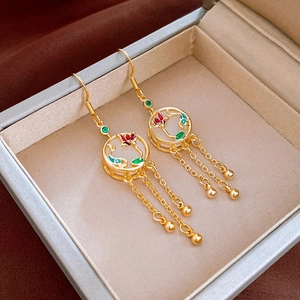 Vintage gold tassel earrings with white stone and red floral enamel details
