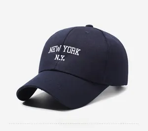Detailed side view of navy blue cotton baseball cap with white New York embroidery