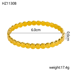 Detailed view of 18K gold plated wide cuff bracelet showing size and weight measurement