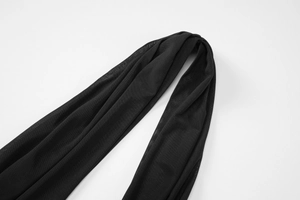 Detail shot of the breathable black mesh fabric with a fine grid texture and drape