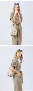 Detail views of a hollow woven wood bead bucket bag held by a model in a khaki outfit.