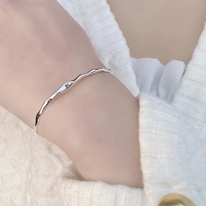 Minimalist S925 sterling silver cuff bracelet with irregular wave pattern for women