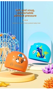 Detail view of silicone swimming caps with cute orange tiger and blue dinosaur cartoon prints
