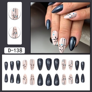 Peacock green glitter press-on nails with floral designs and blue rhinestones