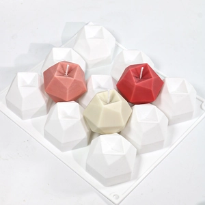 Macro detail of a 9-cavity geometric apple silicone mold for candles and DIY resin crafts
