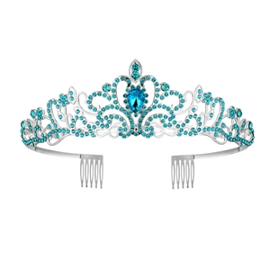 Detailed view of silver tiara with blue water-drop crystal and side hair combs