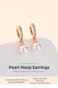 Close-up of rose gold S925 silver hoop earrings with white shell pearls and small crystals