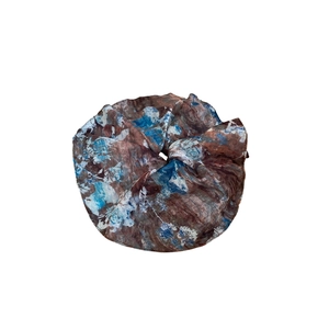 Elegant blue and brown patterned oversized scrunchie hair tie with silky fabric texture