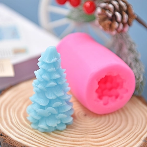 Christmas tree silicone mold set with detailed textured finished candle on rustic wood