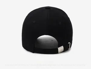 Detailed back view of a black baseball cap featuring an adjustable metal buckle