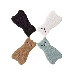 Set of four cute cat-shaped cleaning sponges in black, white, brown and blue colors