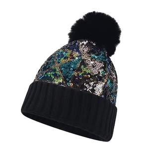 Women's black knit beanie with colorful sequins, pom-pom, and warm ear flaps for winter