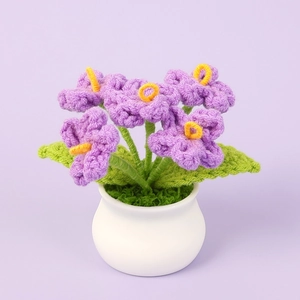 Handmade crochet forget-me-not flower in white ceramic pot for desktop decor
