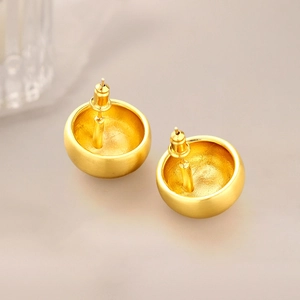 Minimalist brushed gold hemisphere earrings for women in a matte textured finish