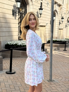 Short V-neck floral mini dress with long puff sleeves and a cinched waist design