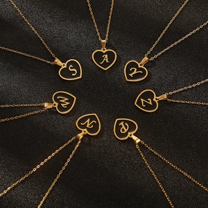 Golden heart initial necklaces with black inlay featuring letters S A Y W Z N P