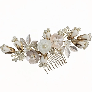 Elegant gold bridal hair comb with ceramic flowers and pearls for wedding hairstyles
