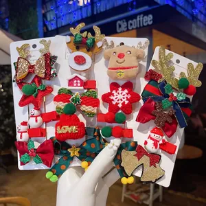 Christmas hair clips set featuring reindeer antlers, snowmen, and festive red velvet bows