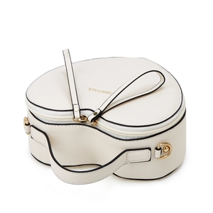 Detail view of heart-shaped cream bag with Saffiano leather texture and gold hardware