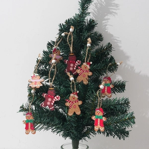 Cartoon gingerbread man wooden Christmas tree hanging ornaments with twine hangers