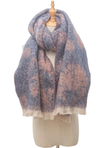 Detail of soft winter scarf with grey-pink floral patterns and delicate fringe trim