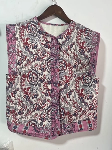 Detail shot of the quilted vest with ethnic floral pattern and precision stitching