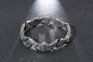 Macro shot of retro geometric steel chain bracelet with intricate vintage engravings