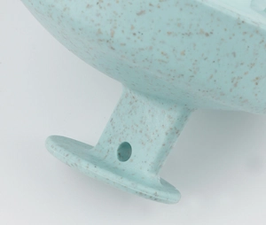 Close-up of eco-friendly wheat straw silicone scalp massager base with 19 teeth and blue texture