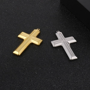 Polished stainless steel cross pendants in gold and silver finish with metal texture