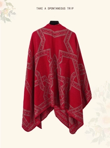 Detail showing the back view of vintage red ethnic style shawl with geometric patterns