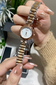 Detailed macro of Scottie women's watch featuring pearl dial and rose gold bezel