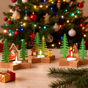 Three star-shaped wooden tea light candle holders with festive Christmas scenes