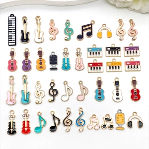 Detailed collection of 36 music-themed enamel charms including guitar and piano pendants